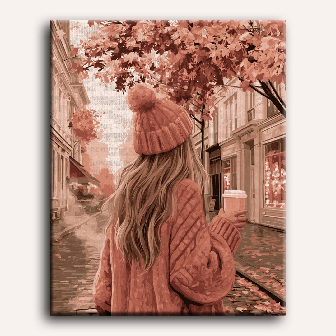 Roze jas in de herfststraat